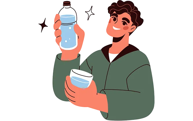 A smiling person holding up a water bottle and a full glass