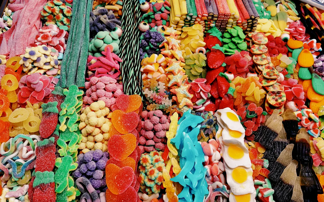 A dense spread of brightly coloured gummy and jelly sweets